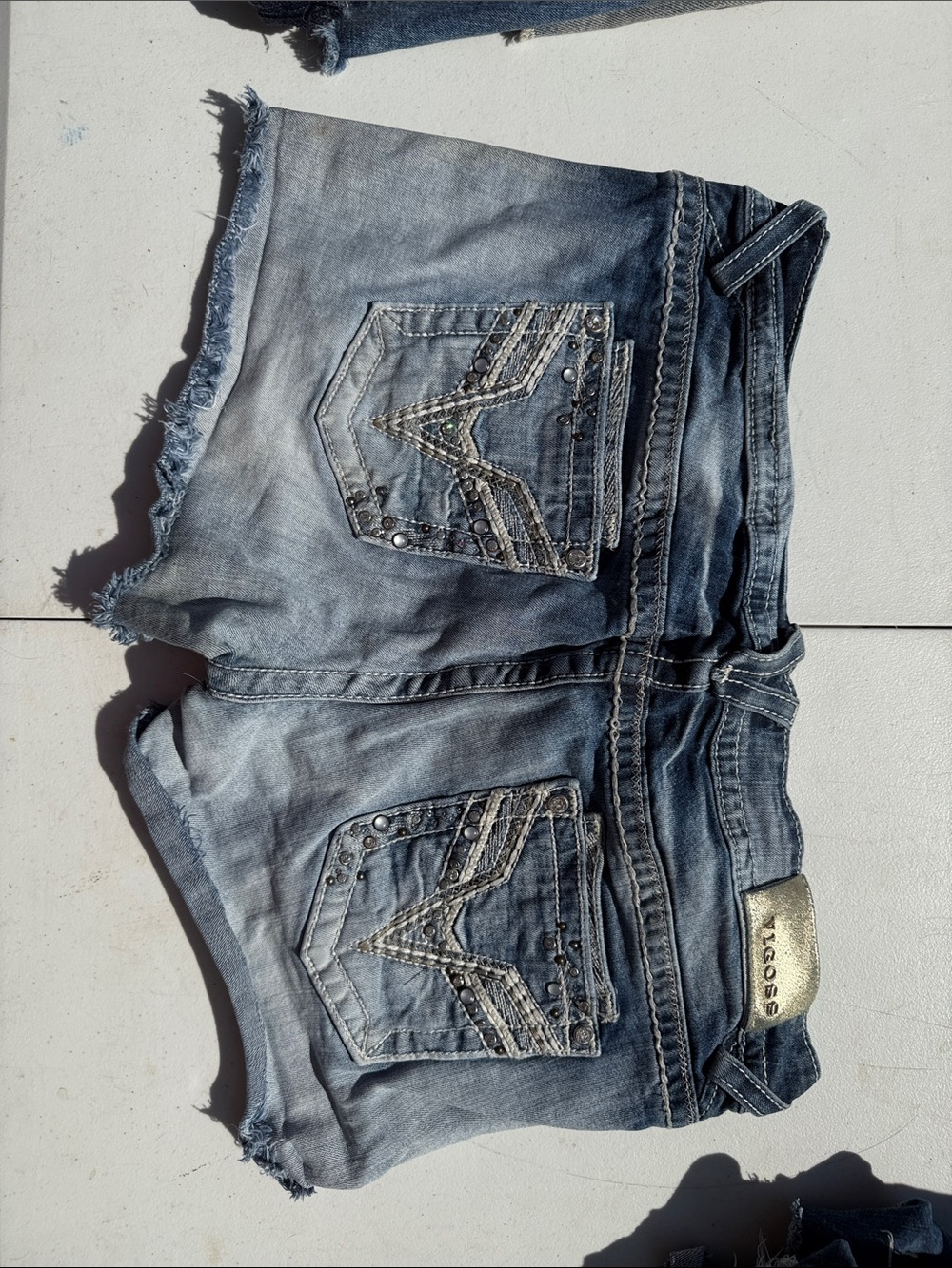 Vigoss Distressed Light Blue Denim Shorts with Embellished Back Pockets